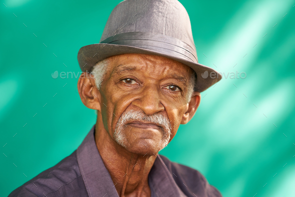 people-portrait-serious-elderly-african-american-man-with-hat-stock